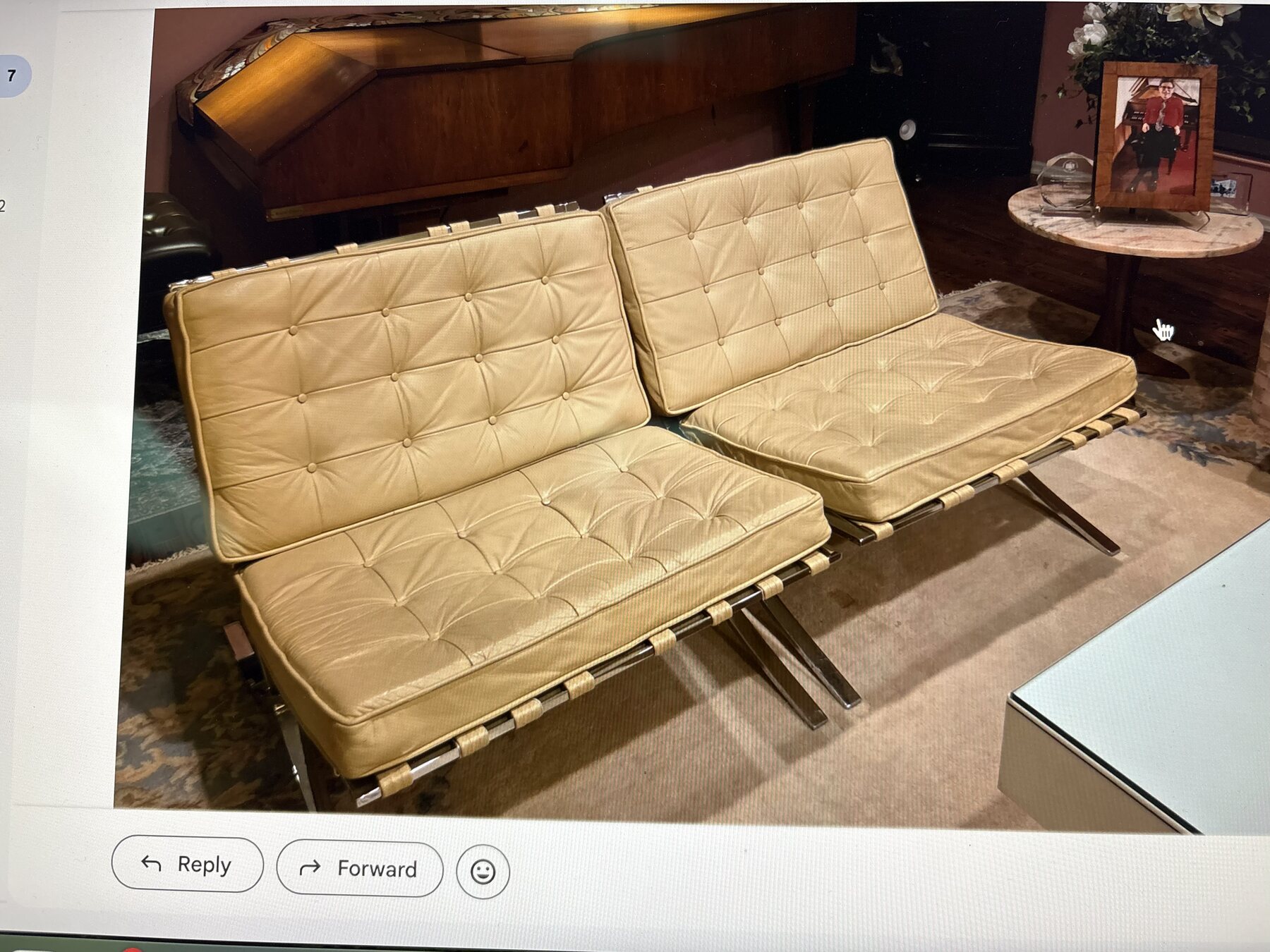 Before restoration view of original 1970s Knoll Barcelona chairs with older tan upholstery
