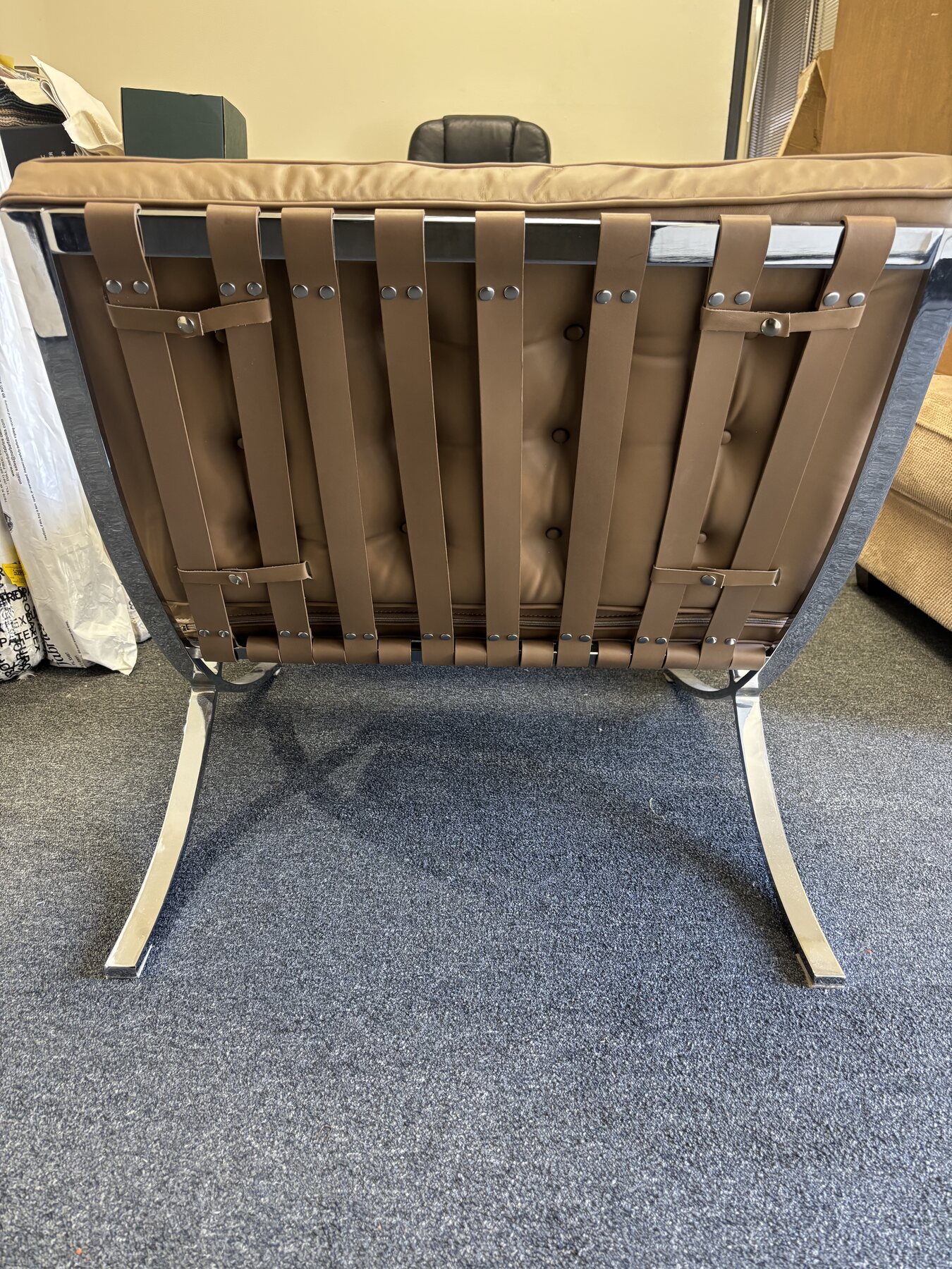 Rear detail of restored Barcelona chair showing new custom-dyed leather straps and rivets