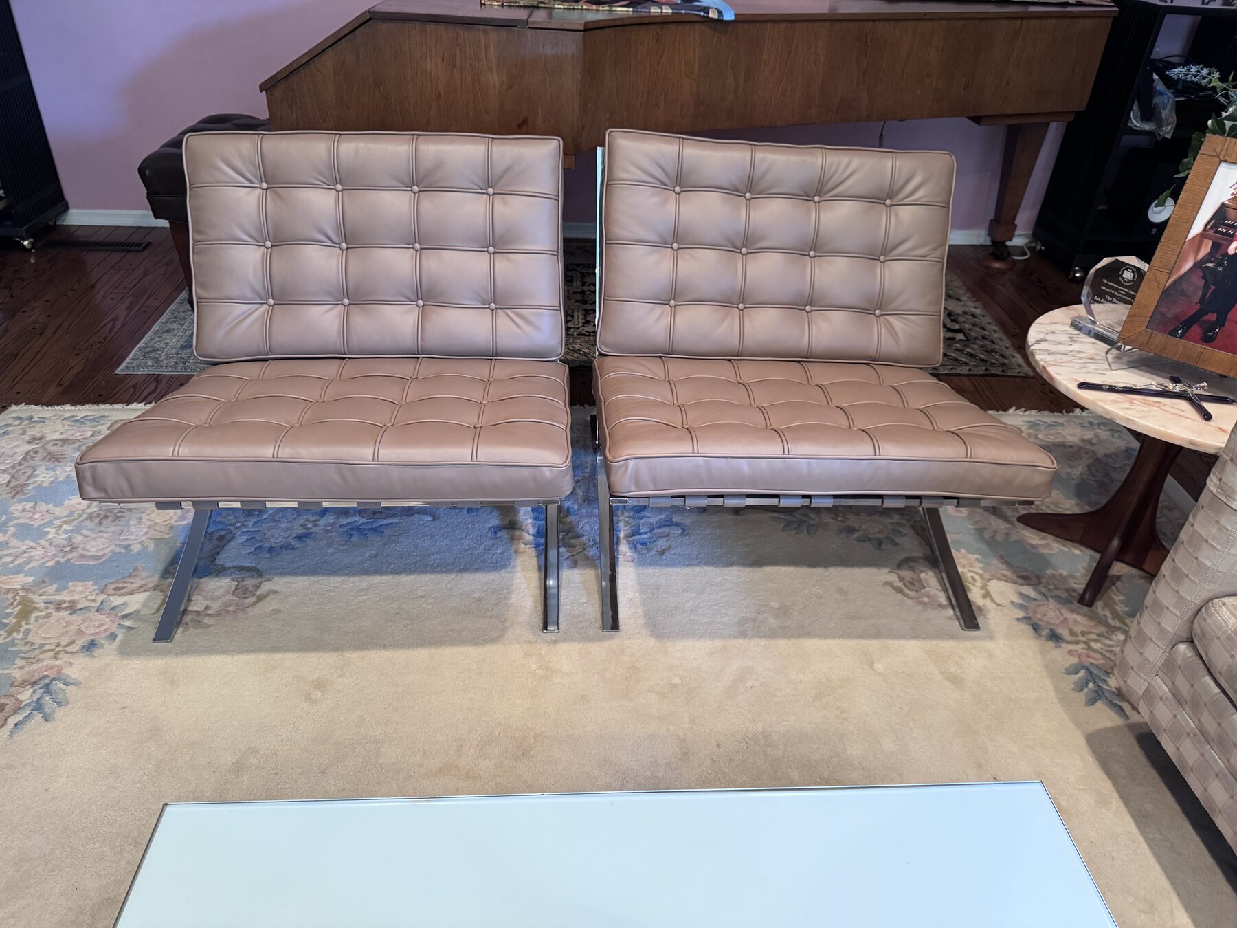 After restoration in-home view of the pair of Knoll Barcelona chairs with restored leather cushions